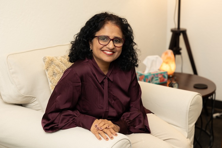 Geetha sitting on couch