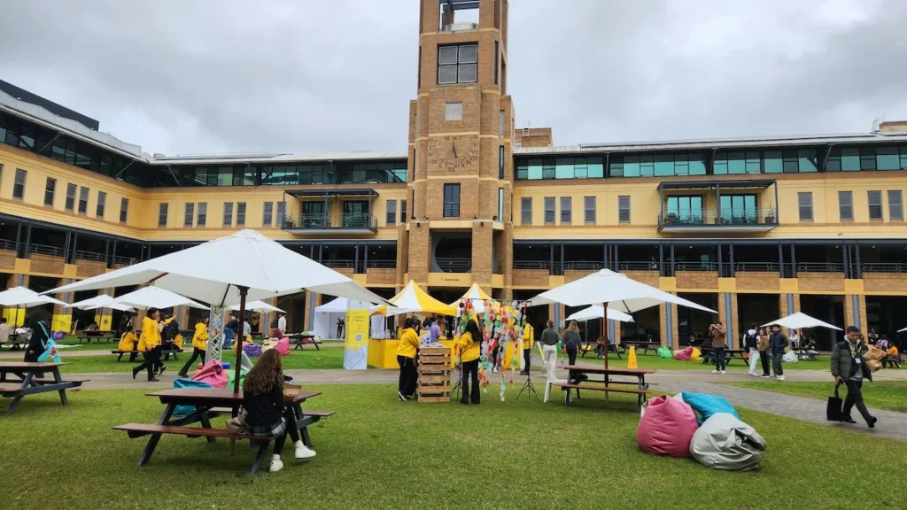 students sitting outside at a college